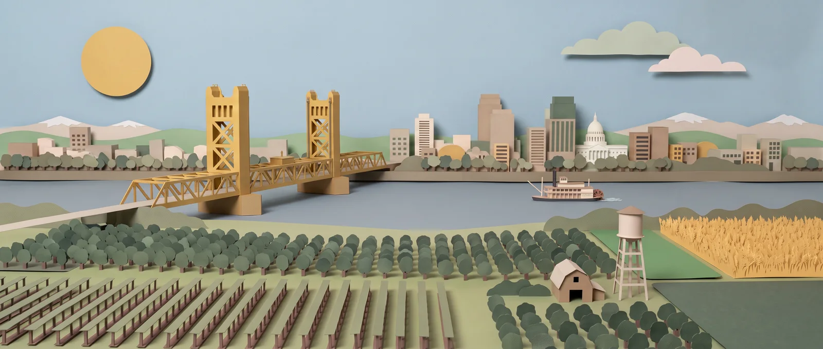 Paper-cut diorama of Highway 99 running through the Central Valley into the Sacramento skyline